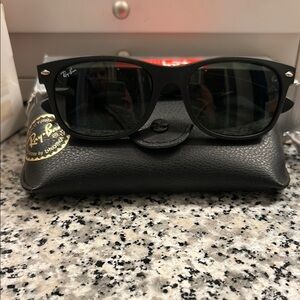 Ray-Ban Black Frame Sunglasses with Dark Lenses